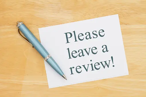 A sign requesting for business reviews